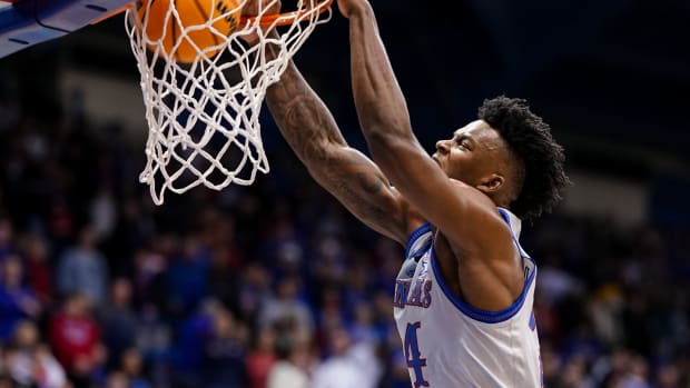 Dec 22, 2022; Lawrence, Kansas, USA; Kansas Jayhawks forward K.J. Adams Jr. (24) dunks the ball during the second half against the Harvard Crimson at Allen Fieldhouse. Mandatory Credit: Jay Biggerstaff-USA TODAY Sports